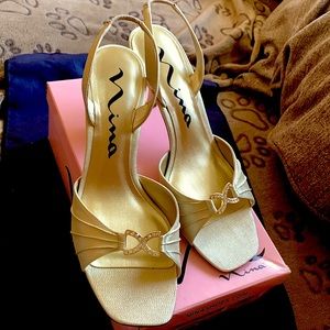 Gold special occasion heels sling back with glittery effect.  Beautiful shoes!